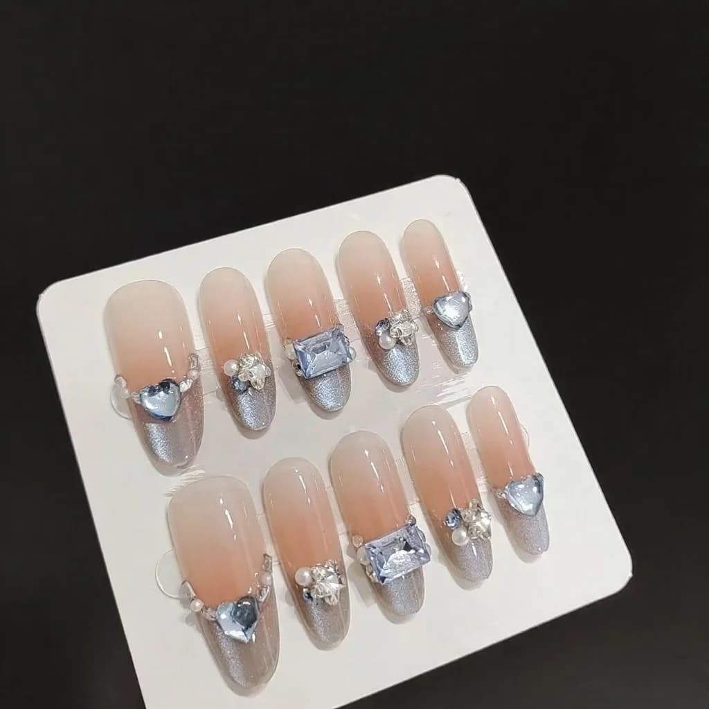 Blå Amber Cat Eye Press-on Negler Fransk Tupp Rhinestone Lang Oval