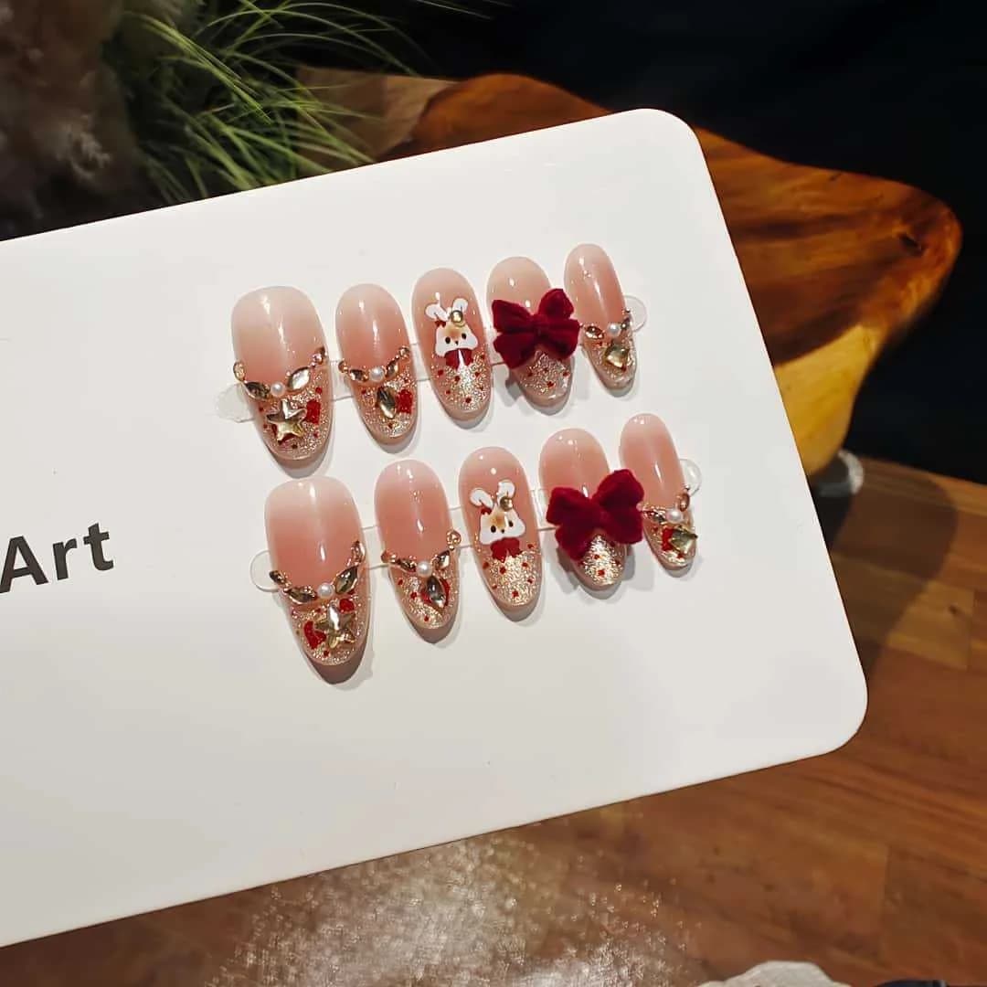 Press-on negler med cat eye, fransk tupp, rhinestones og sløyfedesign
